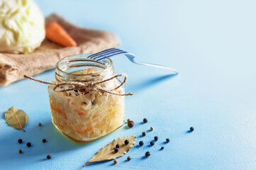 fermented vegetables on blue background. Sauerkraut. carrots
