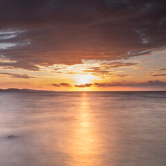 Naklejka na ściany i meble Sunset on the beach in Corsica