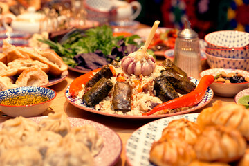 Table served with Uzbek traditional dishes, toned