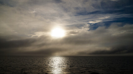 Misty ocean and tree landscape on a rainy day at Cape Froward on the Magellan Strait near Punta...