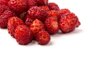 Macro view wild strawberry on white background. Forest red berries