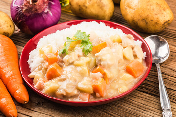 Chicken breast rice cooked with cheese potatoes and carrots