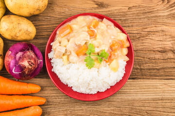 Chicken breast rice cooked with cheese potatoes and carrots