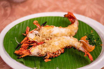 Tasty Seafood prawn freshly baked and finely decorated for customers in a fancy restaurant during the vacation in Bali