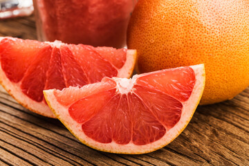 Fresh grapefruits on wooden background with copyspace