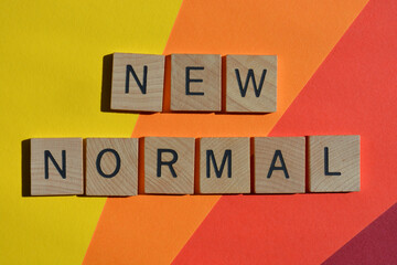 New Normal, words in wooden alphabet letters on colorful background
