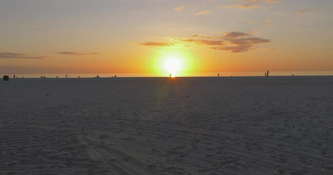 491 Man on the beach running into the sunset