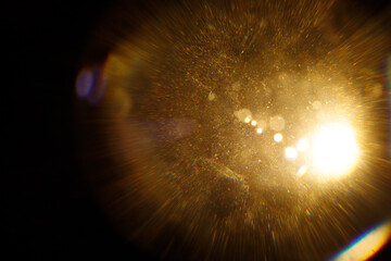 Easy to add lens flare effects for overlay designs or screen blending mode to make high-quality images. Abstract sun burst, digital flare, iridescent glare over black background.