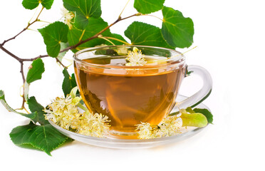 Linden blossoms with cup of tea isolated on a white background.