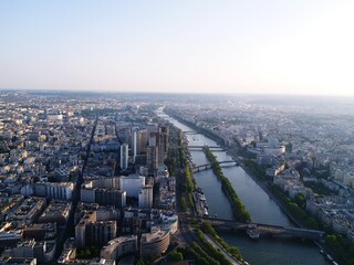 High Angle View Of Siene River Amidst Buildings In Paris City Against Clear Sky