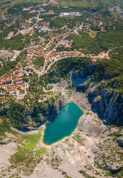 Imotski Blue Lake (Modro jezero) in limestone crater, aerial view. Nature summer landscape, popular tourist destination in Dalmatia, outdoor travel background, vertical image, Croatia