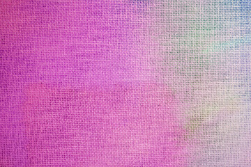 The texture of the canvas is painted. Canvas covered with a thin layer of paint in different colors.