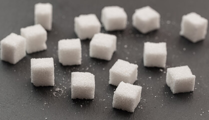 Sugar cubes on black background