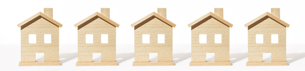 Real estate banner. Group of wooden house model on white background