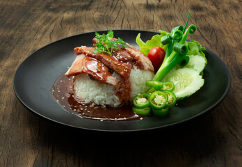 Red Barbeque Pork on Rice recipe with Red Sweet Sauce topped coriander leaf Decorate carved