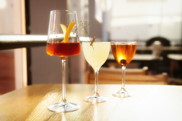 Three simple looking cocktails, toned