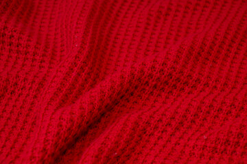 Red woolen knitted wave background