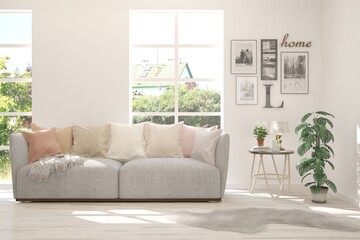 White living room with sofa and summer landscape in window. Scandinavian interior design. 3D illustration