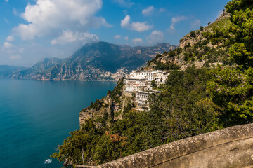 Fototapeta na wymiar A view down the Amalfi coast with the village of Positano, Italy in the distance