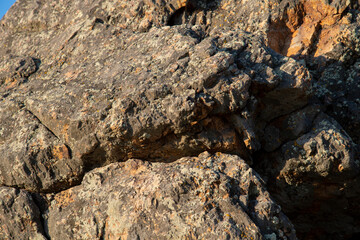Close up big rocks of mountain at golden hour.