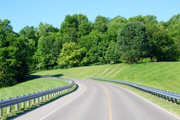 The empty road in the countryside on a sunny day.