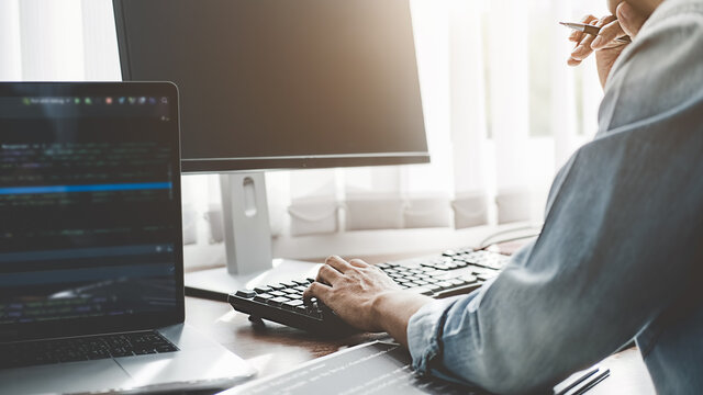 Programmer working in a software development and coding technologies. Website design. Technology concept.