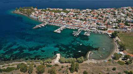 Aerial drone photo of picturesque fishing village of Perdika next to iconic small island of Moni,...