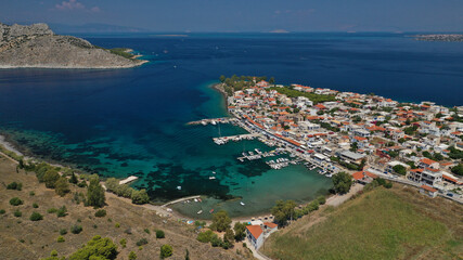 Aerial drone photo of picturesque fishing village of Perdika next to iconic small island of Moni,...