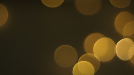 Natural Gold Color Bokeh Particles Effect Photo Overlays Background Glowing Abstract Lens Lights Defocused Circles and Blur Golden Glitter Beautiful Glamour Style. Use Screen Overlay Mode.