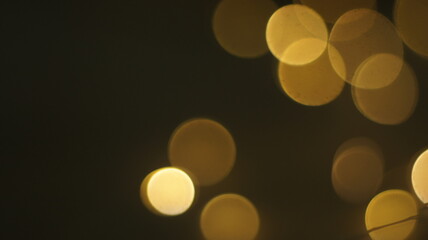 Natural Gold Color Bokeh Particles Effect Photo Overlays Background Glowing Abstract Lens Lights Defocused Circles and Blur Golden Glitter Beautiful Glamour Style. Use Screen Overlay Mode.
