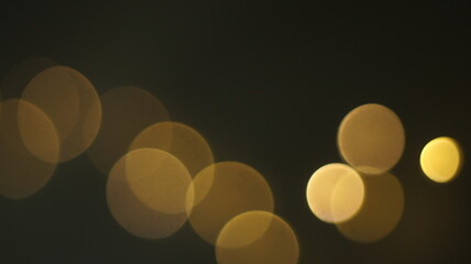 Natural Gold Color Bokeh Particles Effect Photo Overlays Background Glowing Abstract Lens Lights Defocused Circles and Blur Golden Glitter Beautiful Glamour Style. Use Screen Overlay Mode.