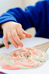 Drawing for children, little artists. Finger paints, free time for toddler. Ice cream cone made of recycled cardboard.