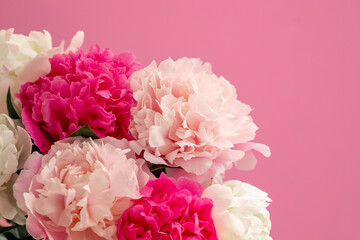Bouquet beautiful flowers on pink background. Universal greeting card. FLatlay with pionies