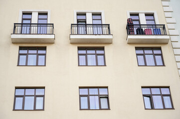 Direct view of the facade of a modern apartment building with balconies.