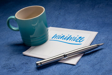 minimize note on napkin with a cup of coffee, simplicity, minimalism and lifestyle concept