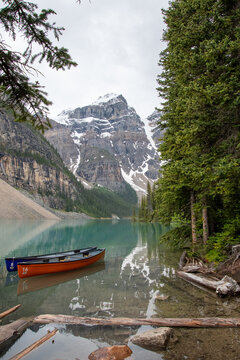 A picture of Moraine lake and ten peaks with boats. AB Canada
