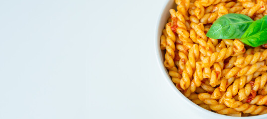 Homemade fresh Italian food with gemelli traditional pasta noodle with bolognese red rosso pesto sauce made from healthy organic tomato spice chili vegan cook recipe