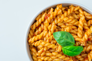 Homemade fresh Italian food with gemelli traditional pasta noodle with bolognese red rosso pesto sauce made from healthy organic tomato spice chili vegan cook recipe