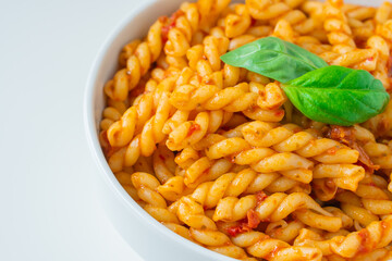 Homemade fresh Italian food with gemelli traditional pasta noodle with bolognese red rosso pesto sauce made from healthy organic tomato spice chili vegan cook recipe