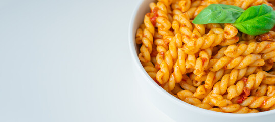 Homemade fresh Italian food with gemelli traditional pasta noodle with bolognese red rosso pesto sauce made from healthy organic tomato spice chili vegan cook recipe