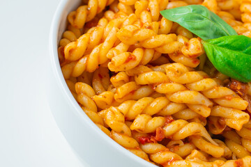 Homemade fresh Italian food with gemelli traditional pasta noodle with bolognese red rosso pesto sauce made from healthy organic tomato spice chili vegan cook recipe