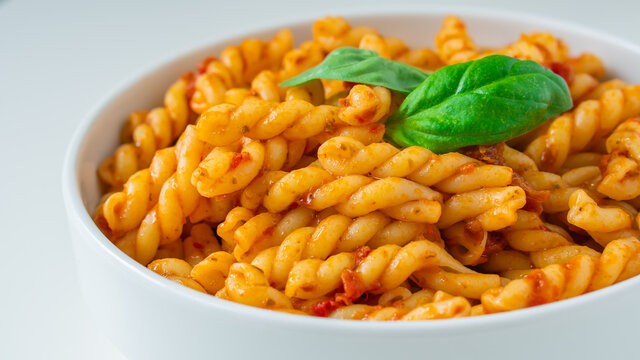 Homemade fresh Italian food with gemelli traditional pasta noodle with bolognese red rosso pesto sauce made from healthy organic tomato spice chili vegan cook recipe