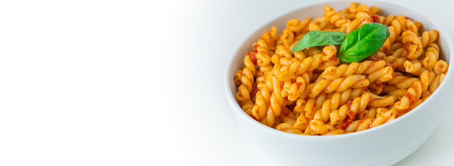 Homemade fresh Italian food with gemelli traditional pasta noodle with bolognese red rosso pesto sauce made from healthy organic tomato spice chili vegan cook recipe