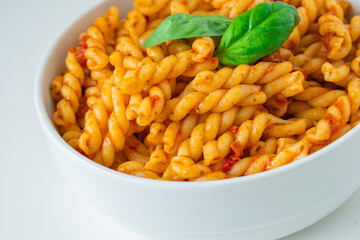 Homemade fresh Italian food with gemelli traditional pasta noodle with bolognese red rosso pesto sauce made from healthy organic tomato spice chili vegan cook recipe