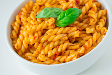 Homemade fresh Italian food with gemelli traditional pasta noodle with bolognese red rosso pesto sauce made from healthy organic tomato spice chili vegan cook recipe