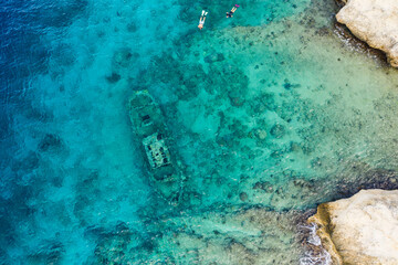 Aerial view of coast of Curaçao in the Caribbean Sea with turquoise water, cliff, Tugboat beach...