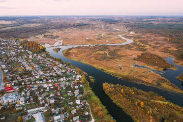 Dobrush, Gomel Region, Belarus. Aerial View Of Dobrush Cityscape Skyline In Autumn Evening. Residential District And River In Bird's-eye View