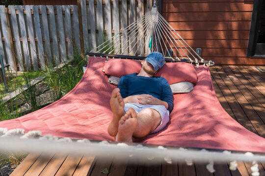 Young Man Napping In A Hammock