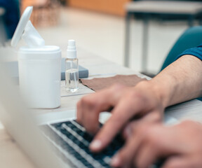 close up. image of a man working on a laptop.