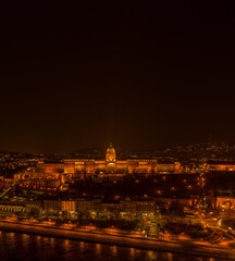 Fototapeta na wymiar Aerial drone shot of Buda castle on Buda Hill in Budapest night with city lights on